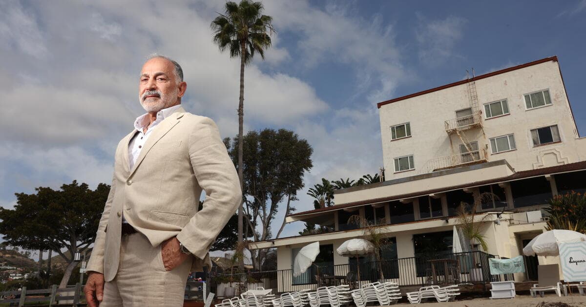 Mo Honarkar standing on the beach in front of Hotel Laguna.